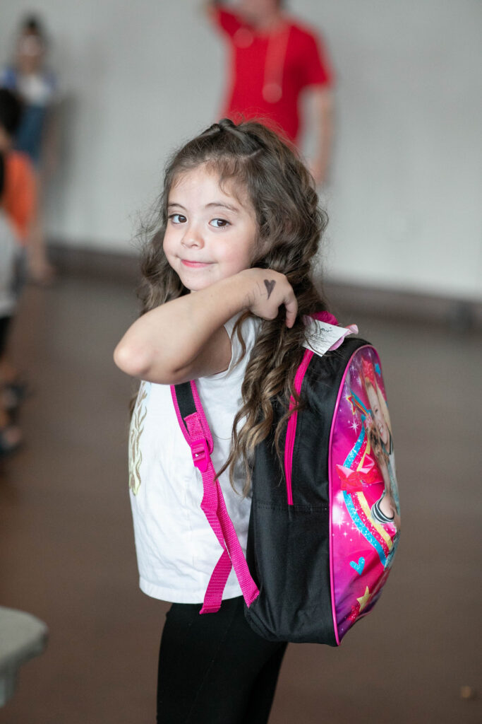 A Little Girl Going To School With Bag Pack. Back To School